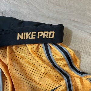 Gold Nike Pro Dri fit shorts with built in spandex, Women’s M